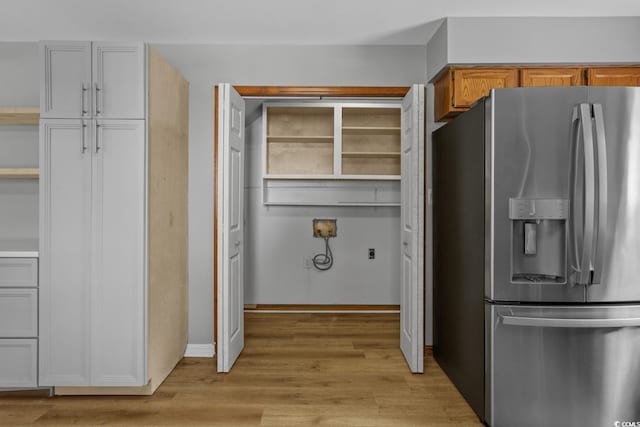 124 Wicklow Way, Pawleys Island, SC 29585 - kitchen featuring stainless steel fridge with ice dispenser, light wood finished floors, and baseboards