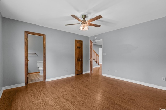 124 Wicklow Way, Pawleys Island, SC 29585 - unfurnished bedroom with wood finished floors, ensuite bathroom, and a ceiling fan
