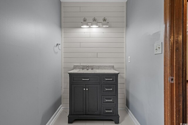 124 Wicklow Way, Pawleys Island, SC 29585 - bathroom with vanity, baseboards, and wooden walls