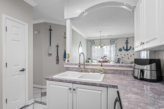 4648 Lightkeepers Way Unit 39A, Little River, SC 29566 - kitchen with crown molding, white cabinetry, a chandelier, light tile patterned floors, and light countertops