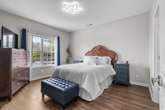 4648 Lightkeepers Way Unit 39A, Little River, SC 29566 - bedroom with dark wood-style flooring and a textured ceiling