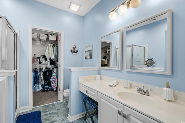 4648 Lightkeepers Way Unit 39A, Little River, SC 29566 - bathroom with a shower stall, a walk in closet, and vanity