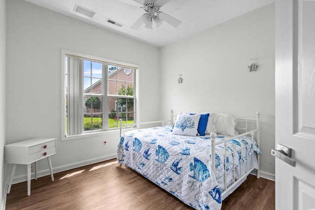 4648 Lightkeepers Way Unit 39A, Little River, SC 29566 - bedroom with wood finished floors and a ceiling fan