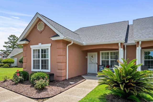 4648 Lightkeepers Way Unit 39A, Little River, SC 29566 - view of front facade featuring a shingled roof and stucco siding