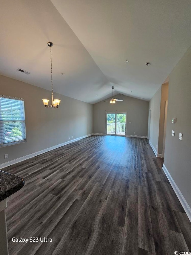 340 Kiskadee Loop, Conway, SC 29526 - unfurnished living room with lofted ceiling, dark wood finished floors, baseboards, a ceiling fan, and a chandelier