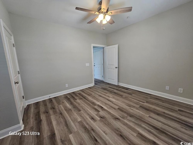 340 Kiskadee Loop, Conway, SC 29526 - unfurnished bedroom with dark wood finished floors, baseboards, and a ceiling fan