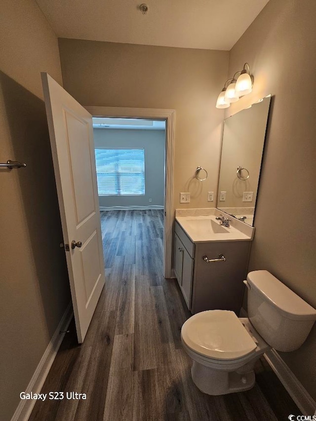 340 Kiskadee Loop, Conway, SC 29526 - half bathroom with toilet, wood finished floors, vanity, and baseboards
