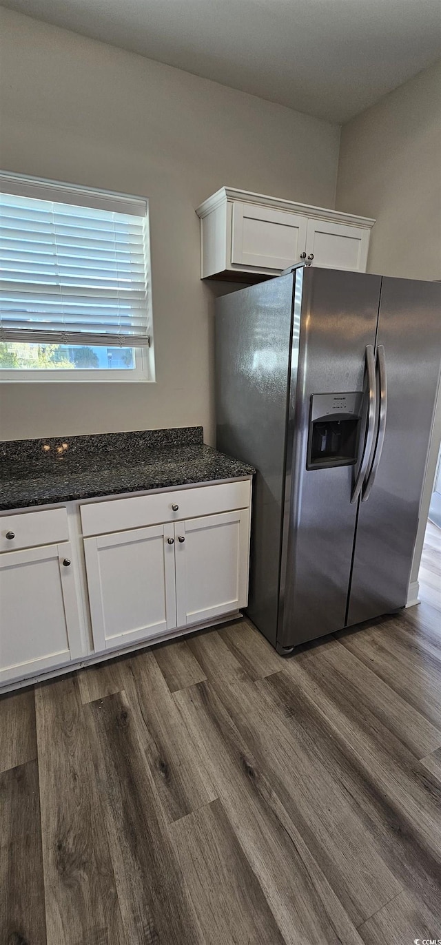 340 Kiskadee Loop, Conway, SC 29526 - kitchen with stainless steel refrigerator with ice dispenser, dark wood-style flooring, white cabinetry, and dark stone countertops