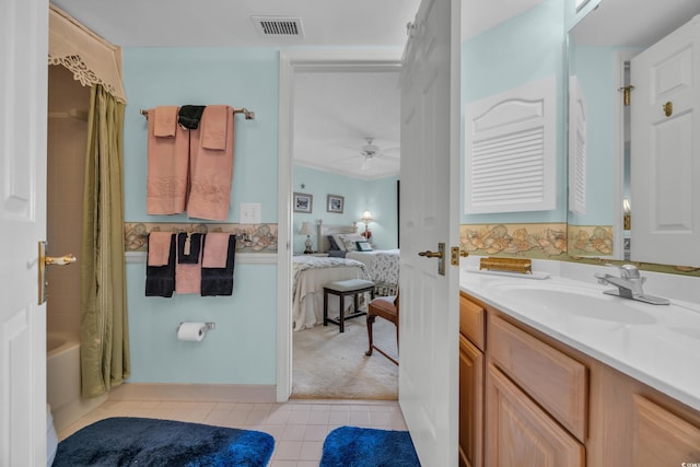 145 S Dunes Dr Unit 308, Pawleys Island, SC 29585 - ensuite bathroom with tile patterned flooring, ceiling fan, vanity, and shower / bath combo