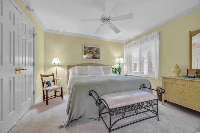 145 S Dunes Dr Unit 308, Pawleys Island, SC 29585 - bedroom with light colored carpet, a closet, ornamental molding, ceiling fan, and a textured ceiling