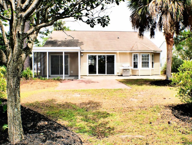 230 Vermillion Dr, Little River, SC 29566 - rear view of property featuring a patio, a sunroom, a yard, and a shingled roof