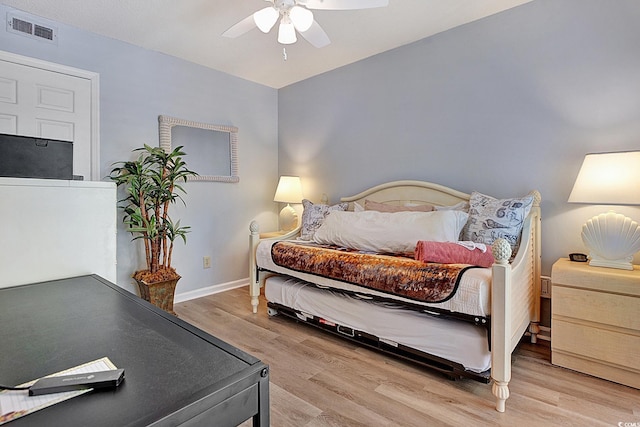 211 76th Ave N Unit A3, Myrtle Beach, SC 29572 - bedroom with light wood-style flooring and ceiling fan