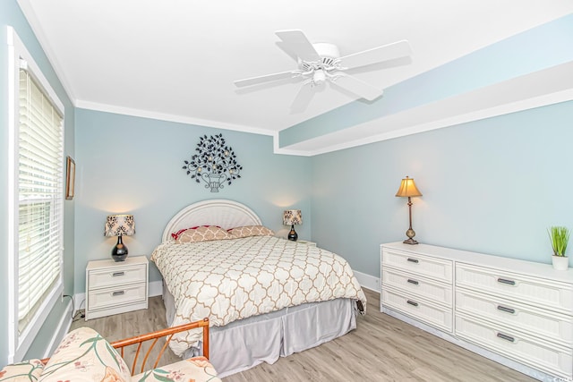 4309 Beverly Ct, North Myrtle Beach, SC 29582 - bedroom with light wood-style flooring, ceiling fan, and ornamental molding