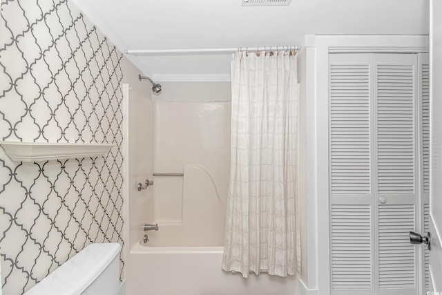 4309 Beverly Ct, North Myrtle Beach, SC 29582 - bathroom with a closet and shower / bathtub combination with curtain