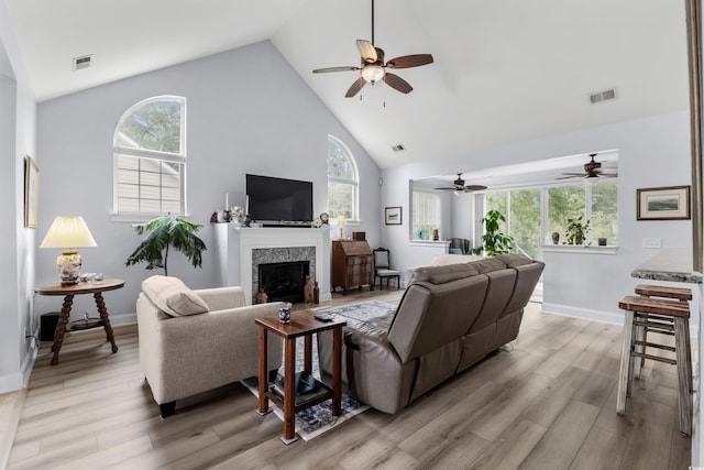 341 Bahama Dr, Murrells Inlet, SC 29576 - living room with a ceiling fan, high vaulted ceiling, light wood finished floors, and a high end fireplace