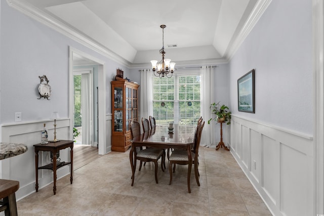 341 Bahama Dr, Murrells Inlet, SC 29576 - dining area with a chandelier, a decorative wall, a wainscoted wall, and crown molding