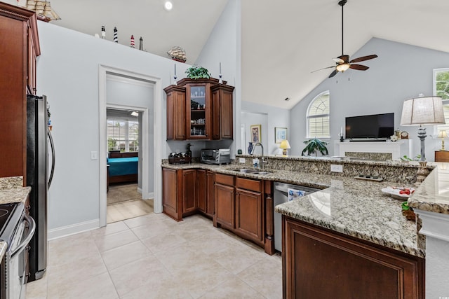 341 Bahama Dr, Murrells Inlet, SC 29576 - kitchen with appliances with stainless steel finishes, a sink, ceiling fan, healthy amount of natural light, and high vaulted ceiling