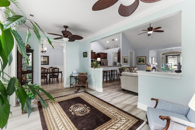 341 Bahama Dr, Murrells Inlet, SC 29576 - living area with a ceiling fan, light wood finished floors, lofted ceiling, and crown molding