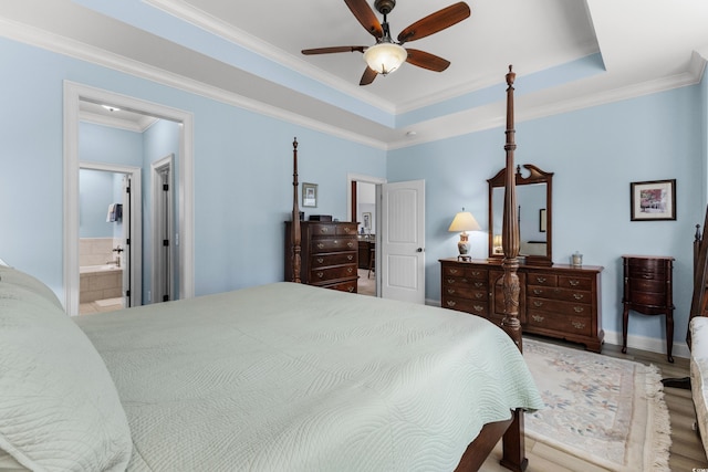 341 Bahama Dr, Murrells Inlet, SC 29576 - bedroom featuring ornamental molding, wood finished floors, ensuite bath, a ceiling fan, and a raised ceiling