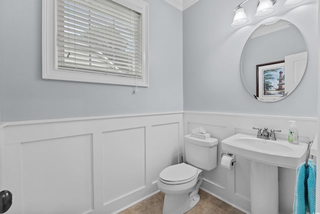 341 Bahama Dr, Murrells Inlet, SC 29576 - half bath featuring toilet, a decorative wall, a wainscoted wall, crown molding, and tile patterned flooring