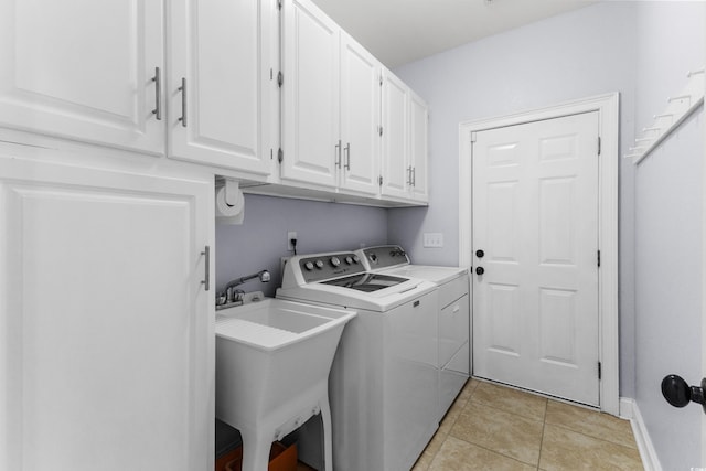 341 Bahama Dr, Murrells Inlet, SC 29576 - washroom with cabinet space, separate washer and dryer, light tile patterned floors, and baseboards
