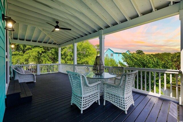 17 Trigger Fish Ln, Murrells Inlet, SC 29576 - deck at dusk with ceiling fan and outdoor dining space