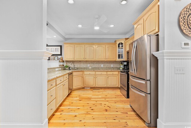 17 Trigger Fish Ln, Murrells Inlet, SC 29576 - kitchen with light brown cabinetry, stainless steel appliances, crown molding, a sink, and light wood-style flooring