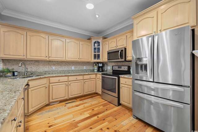 17 Trigger Fish Ln, Murrells Inlet, SC 29576 - kitchen featuring appliances with stainless steel finishes, light brown cabinetry, a sink, crown molding, and light wood-type flooring