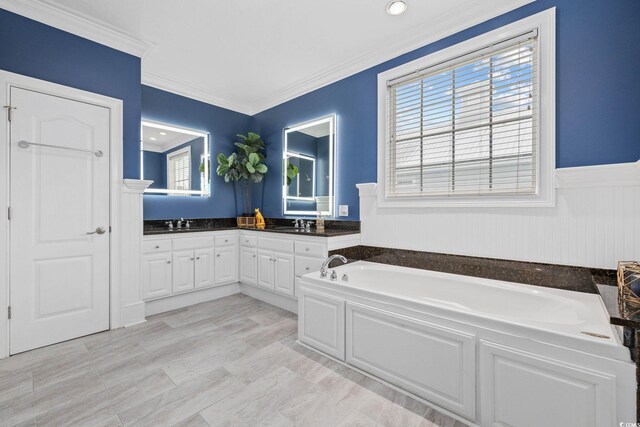 17 Trigger Fish Ln, Murrells Inlet, SC 29576 - bathroom with a bath, double vanity, a wainscoted wall, and crown molding