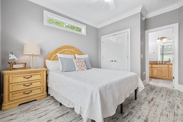 17 Trigger Fish Ln, Murrells Inlet, SC 29576 - bedroom featuring light wood-style floors, crown molding, a closet, a sink, and ensuite bath