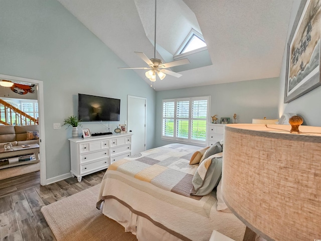 323 Wendover Ct Unit 10-A, Myrtle Beach, SC 29572 - bedroom featuring multiple windows, dark wood-style flooring, a skylight, high vaulted ceiling, and a ceiling fan