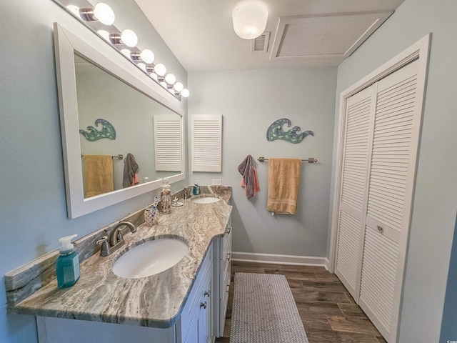 323 Wendover Ct Unit 10-A, Myrtle Beach, SC 29572 - bathroom with a closet, wood finished floors, and double vanity
