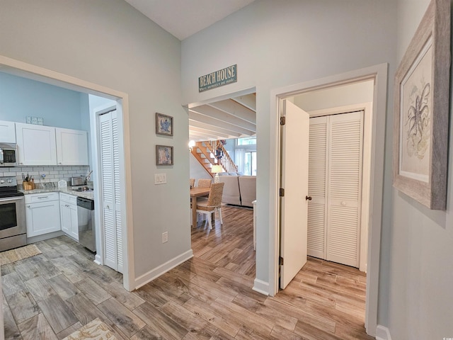 323 Wendover Ct Unit 10-A, Myrtle Beach, SC 29572 - corridor with light wood-style flooring and a high ceiling