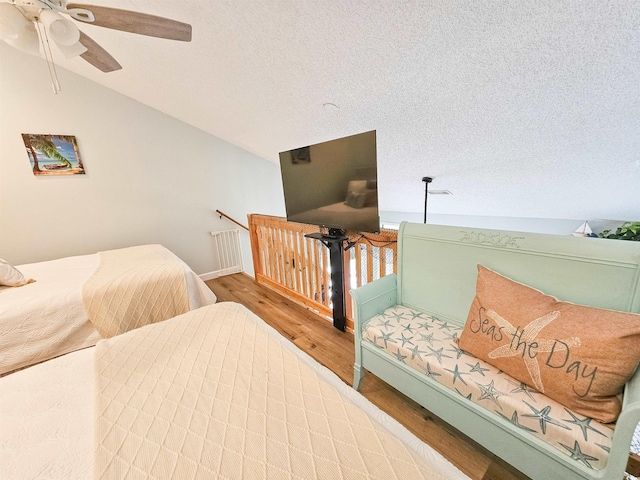 323 Wendover Ct Unit 10-A, Myrtle Beach, SC 29572 - bedroom with wood finished floors, a textured ceiling, a ceiling fan, and lofted ceiling