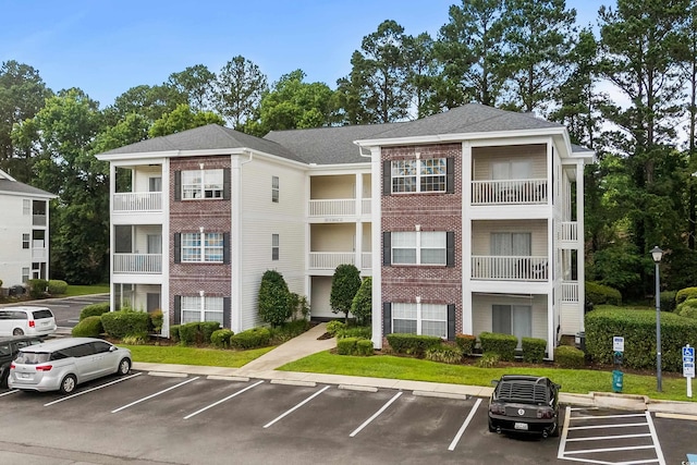1302 River Oak Dr Unit 4B, Myrtle Beach, SC 29579 - view of property featuring uncovered parking
