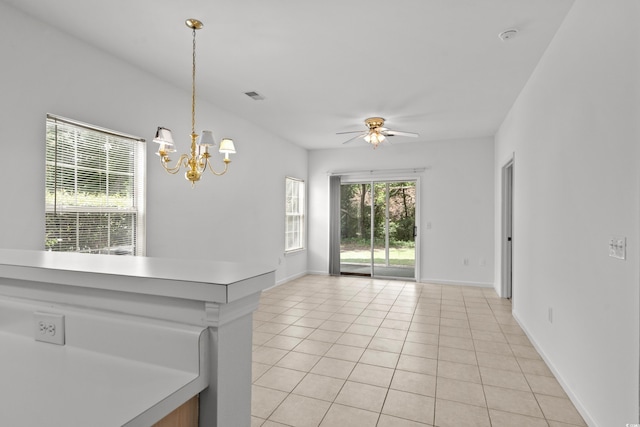 1302 River Oak Dr Unit 4B, Myrtle Beach, SC 29579 - empty room featuring light tile patterned floors, a ceiling fan, a chandelier, and baseboards