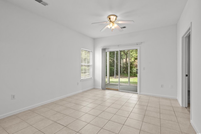 1302 River Oak Dr Unit 4B, Myrtle Beach, SC 29579 - spare room with ceiling fan, light tile patterned flooring, and baseboards