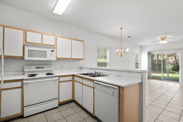 1302 River Oak Dr Unit 4B, Myrtle Beach, SC 29579 - kitchen with white appliances, a sink, light tile patterned floors, a peninsula, and plenty of natural light