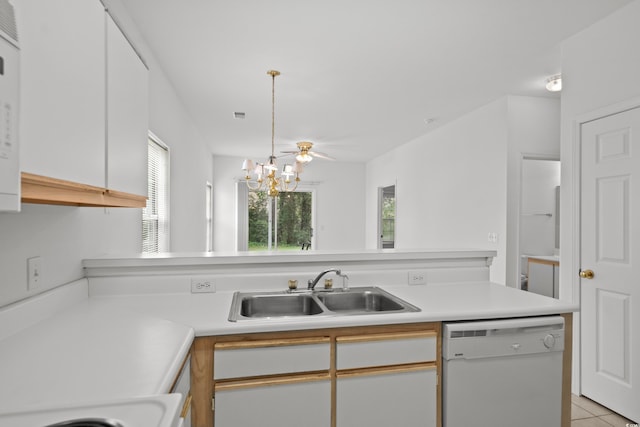 1302 River Oak Dr Unit 4B, Myrtle Beach, SC 29579 - kitchen featuring white dishwasher, a sink, light countertops, a chandelier, and light tile patterned floors