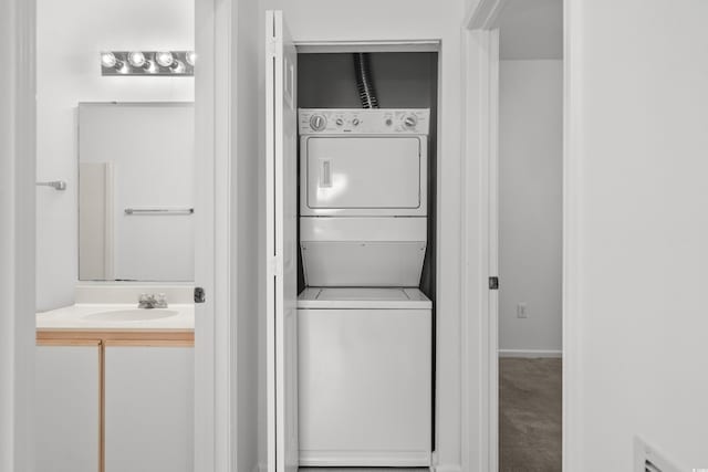 1302 River Oak Dr Unit 4B, Myrtle Beach, SC 29579 - laundry area featuring stacked washer and clothes dryer and carpet floors