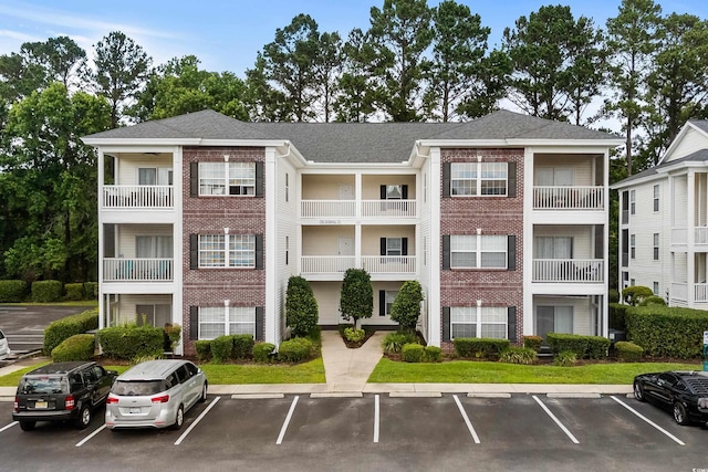 1302 River Oak Dr Unit 4B, Myrtle Beach, SC 29579 - view of property featuring uncovered parking