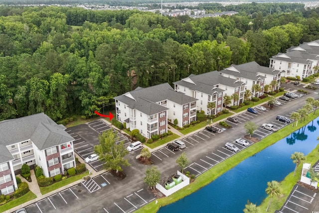 1302 River Oak Dr Unit 4B, Myrtle Beach, SC 29579 - aerial view of residential area featuring a nearby body of water and a forest