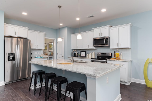 170 Bantry Ln, Conway, SC 29526 - kitchen featuring appliances with stainless steel finishes, dark wood-type flooring, backsplash, white cabinetry, and recessed lighting
