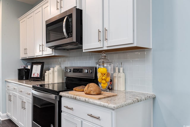 170 Bantry Ln, Conway, SC 29526 - kitchen with appliances with stainless steel finishes, white cabinetry, and backsplash
