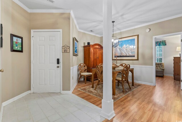 405 Pipers Ln Unit 405, Myrtle Beach, SC 29575 - entryway featuring crown molding, light wood finished floors, a chandelier, and baseboards