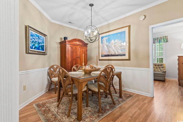 405 Pipers Ln Unit 405, Myrtle Beach, SC 29575 - dining room with light wood finished floors, a chandelier, ornamental molding, and baseboards