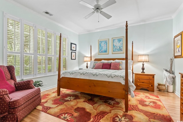 405 Pipers Ln Unit 405, Myrtle Beach, SC 29575 - bedroom featuring wood finished floors, crown molding, a ceiling fan, and baseboards