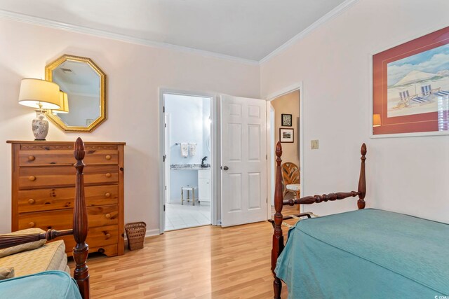 405 Pipers Ln Unit 405, Myrtle Beach, SC 29575 - bedroom with light wood-style floors, crown molding, ensuite bath, and baseboards