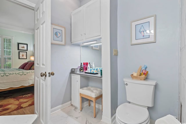 405 Pipers Ln Unit 405, Myrtle Beach, SC 29575 - bathroom featuring toilet, vanity, baseboards, ensuite bathroom, and marble finish floors