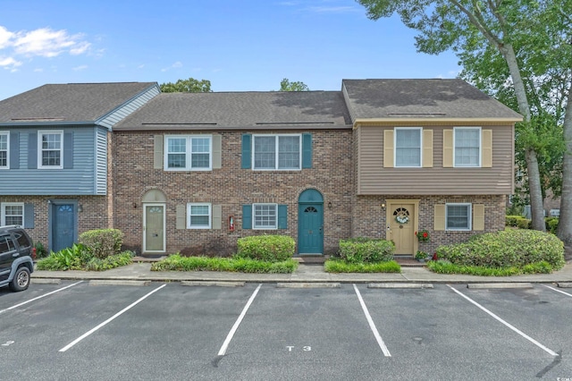 830 44th Ave N Unit T3, Myrtle Beach, SC 29577 - view of property featuring uncovered parking and brick siding